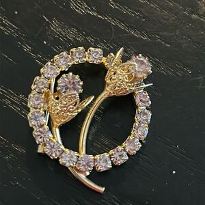 2 Rhinestone circle pins featuring Flowers